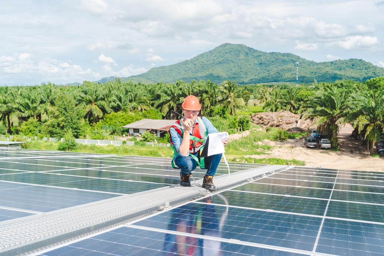 professional engineer inspecting solar panels