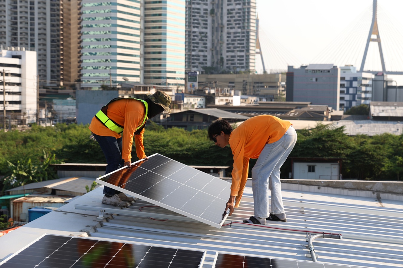 technicians installing photovoltaic solar modules